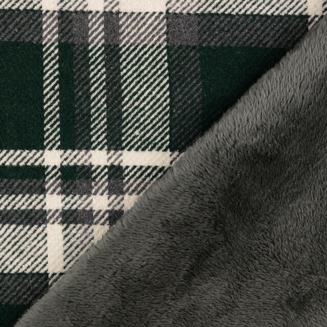 Gewebtes karostoff mit fellabseite tannengrün